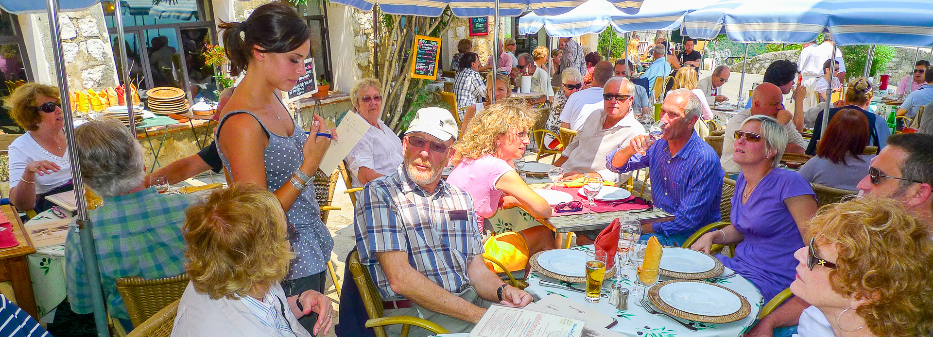  Busy summer lunch service at the Taverne Provencal, Gourdon.